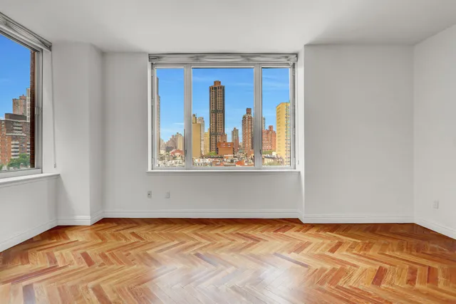 a view of an empty room with windows