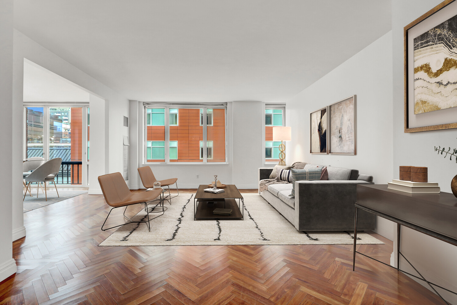 90 East End Avenue, Unit 10B Manhattan, NY 10028 - Photo 5 of 39 a living room with furniture a rug and wall painting