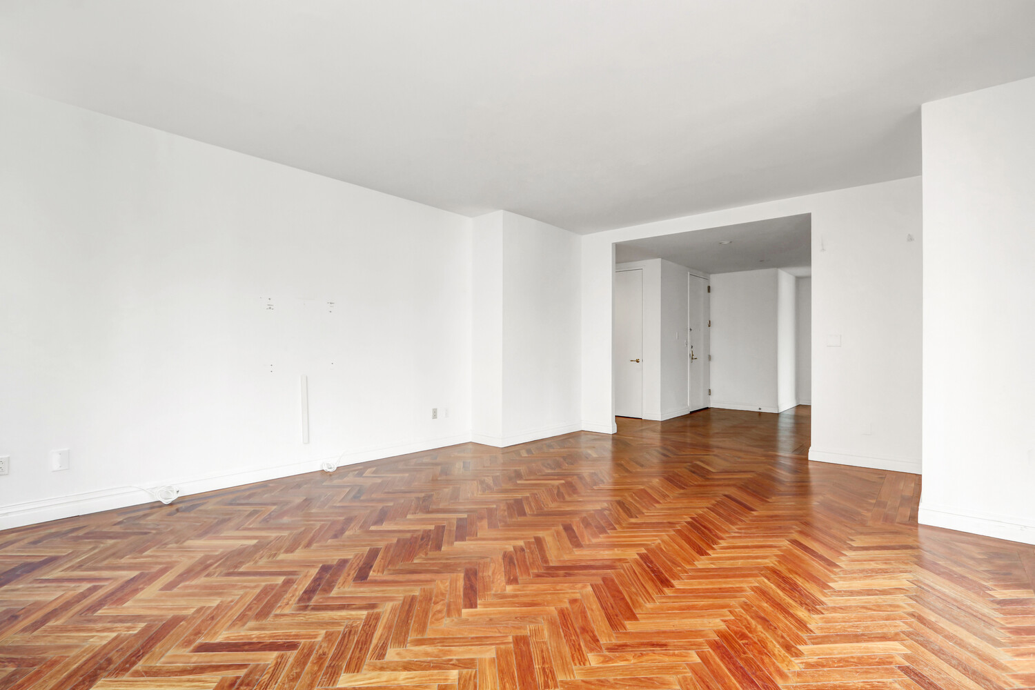 90 East End Avenue, Unit 10B Manhattan, NY 10028 - Photo 9 of 39 a view of an empty room and wooden floor
