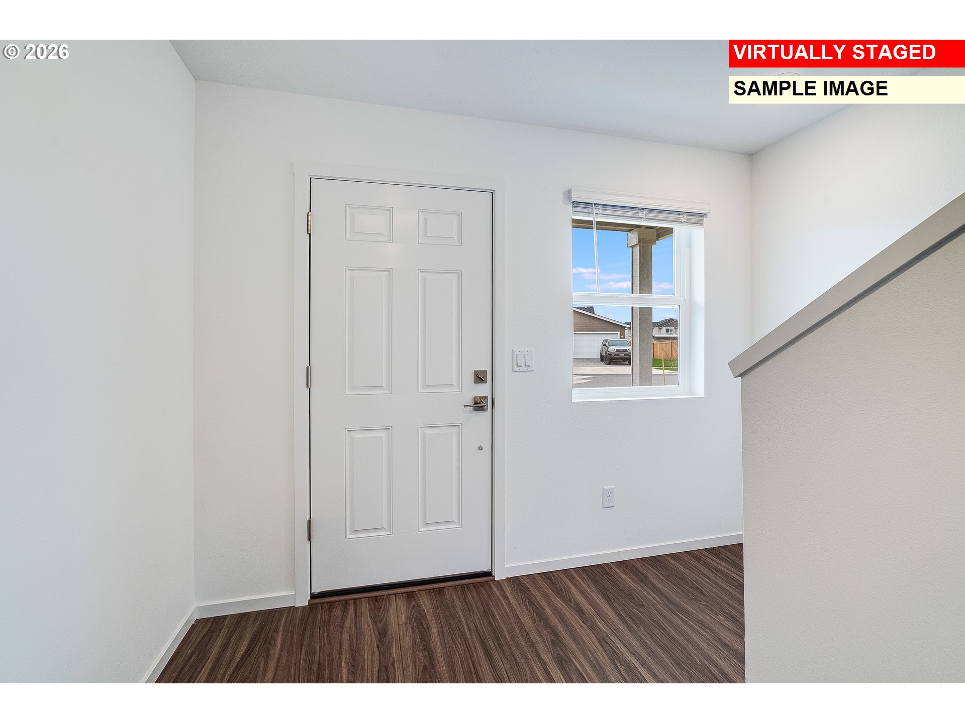 5749 Bainbridge Road Eugene, OR 97402 - Photo 3 of 15 a view of an entryway with wooden floor