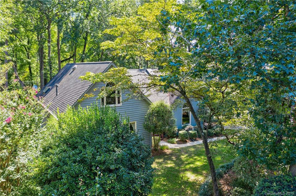 5123 Randolph Road Charlotte, NC 28211 - Photo 2 of 28 a backyard of a house with table and chairs under an umbrella