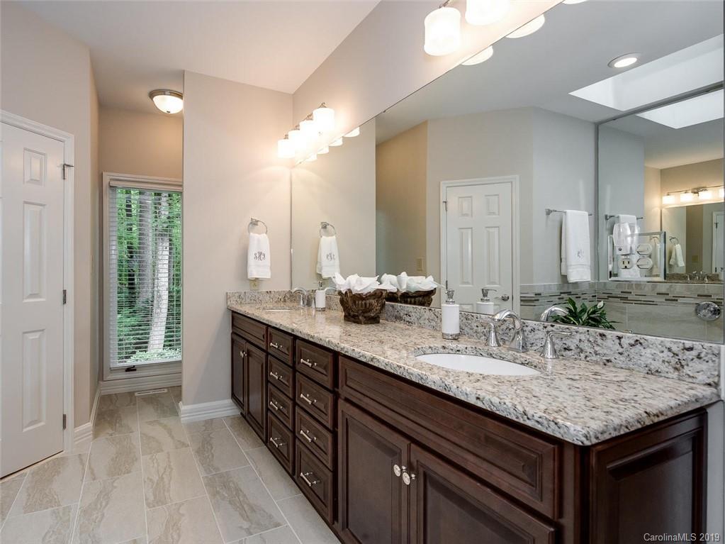 5123 Randolph Road Charlotte, NC 28211 - Photo 15 of 28 a bathroom with a granite countertop sink and a mirror