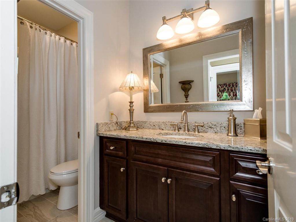 5123 Randolph Road Charlotte, NC 28211 - Photo 19 of 28 a bathroom with a granite countertop sink and a toilet
