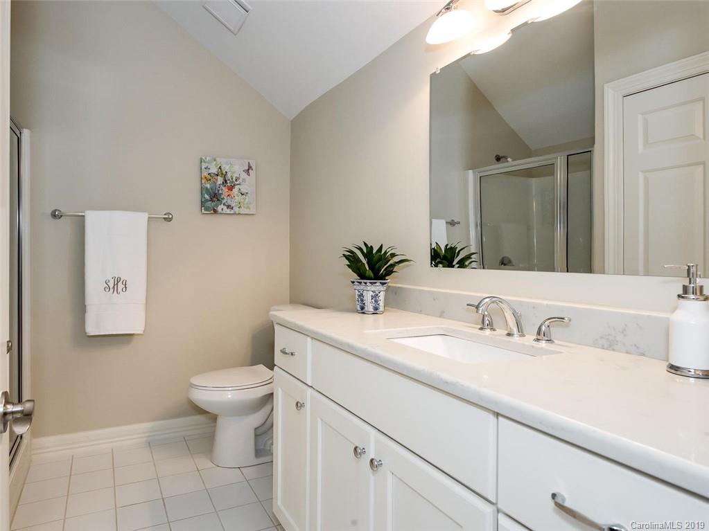 5123 Randolph Road Charlotte, NC 28211 - Photo 22 of 28 a bathroom with a sink toilet and mirror