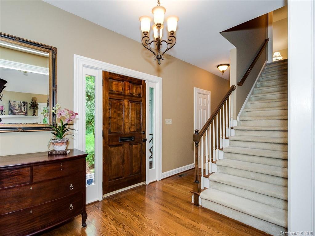 5123 Randolph Road Charlotte, NC 28211 - Photo 5 of 28 a view of a hallway view with wooden floor and staircase