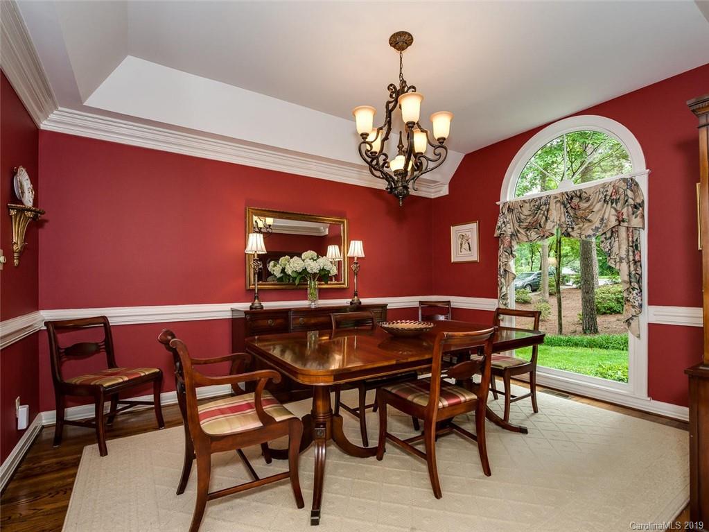 5123 Randolph Road Charlotte, NC 28211 - Photo 6 of 28 a view of a dining room with furniture a chandelier and wooden floor