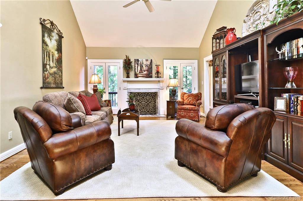 5123 Randolph Road Charlotte, NC 28211 - Photo 8 of 28 a living room with furniture fireplace and a flat screen tv