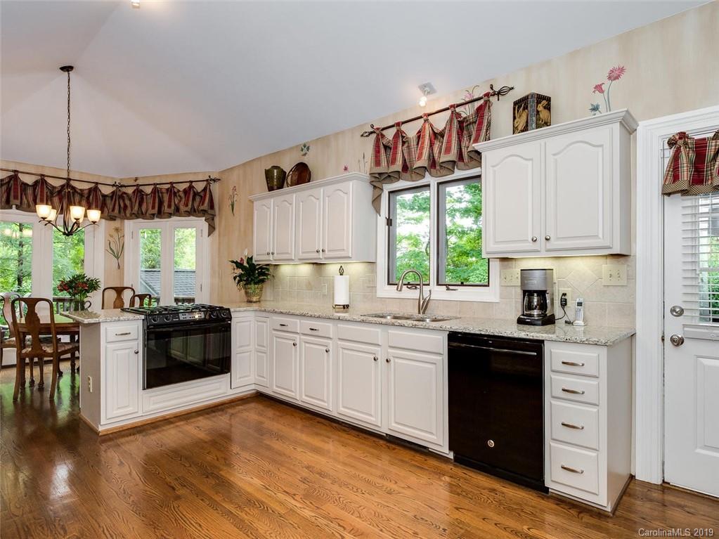5123 Randolph Road Charlotte, NC 28211 - Photo 10 of 28 a kitchen with a sink cabinets and window
