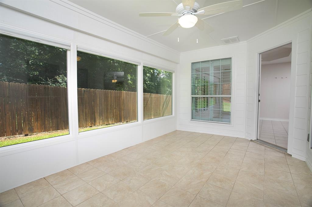 1521 Rice Road, Unit E105 Tyler, TX 75703 - Photo 16 of 29 a view of an empty room with a window