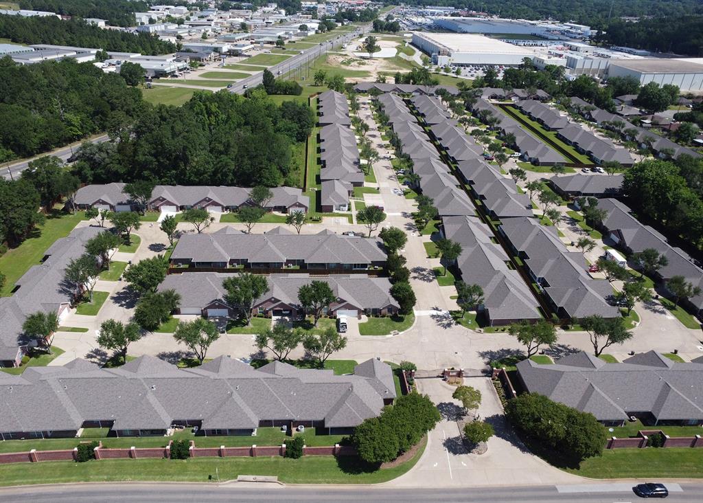 1521 Rice Road, Unit E105 Tyler, TX 75703 - Photo 26 of 29 an aerial view of multiple houses with yard