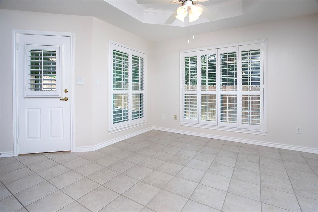 1521 Rice Road, Unit E105 Tyler, TX 75703 - Photo 10 of 29 a view of an empty room with a window
