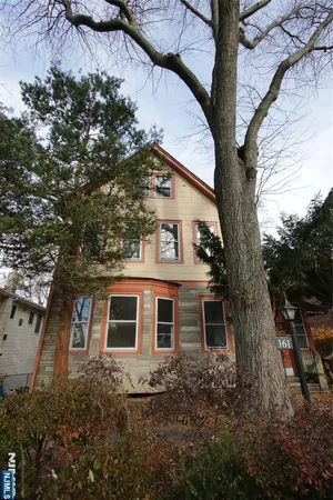 a big house with large trees
