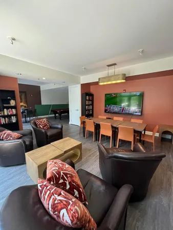 a living room with furniture and a table