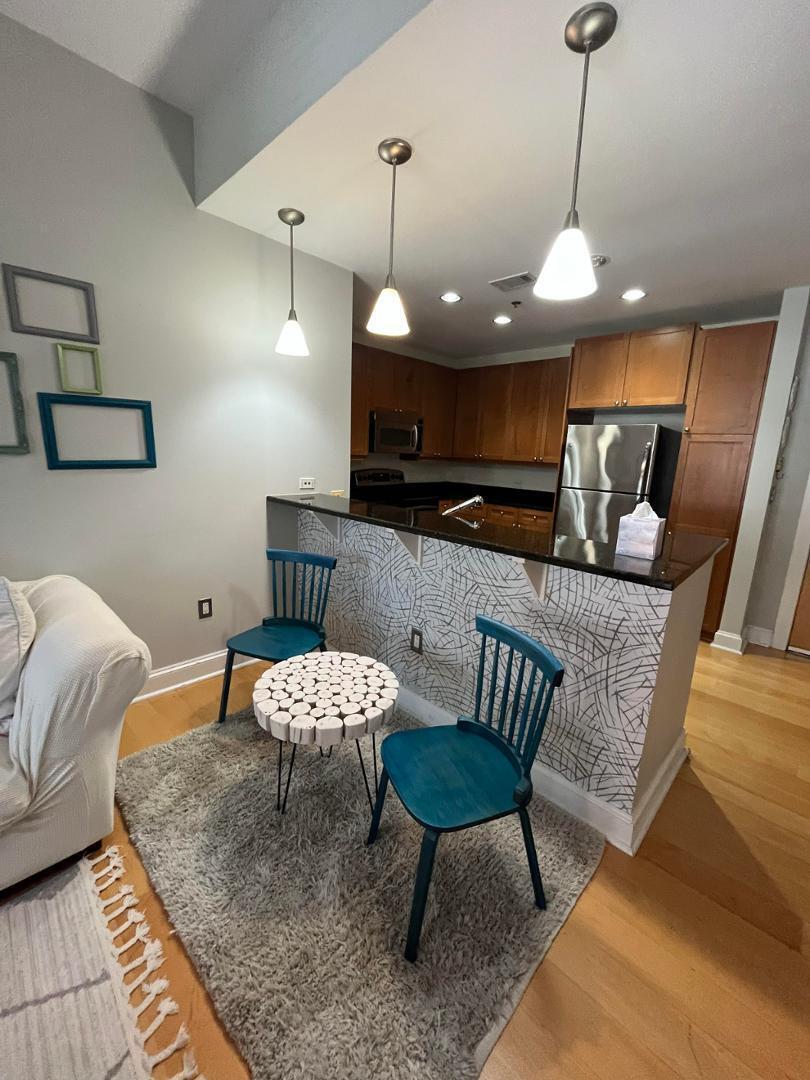 618 North Boylan Avenue Raleigh, NC 27603 - Photo 2 of 15 a living room with furniture and a wooden floor