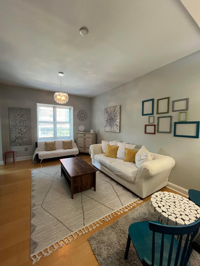 618 North Boylan Avenue Raleigh, NC 27603 - Photo 4 of 15 a living room with furniture and a large window