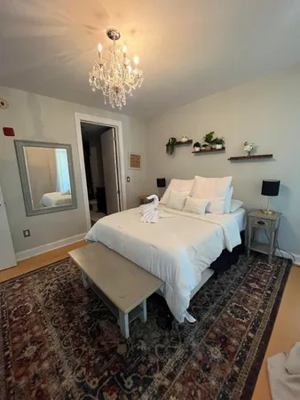 a bedroom with bed and window