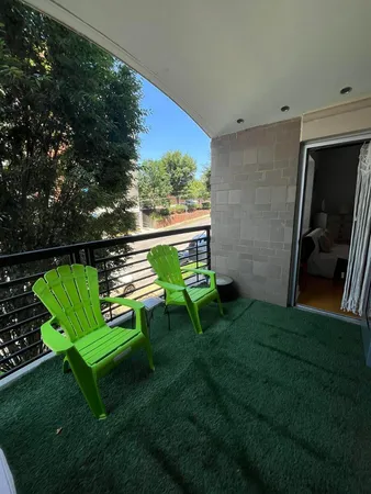 a view of a backyard with chairs