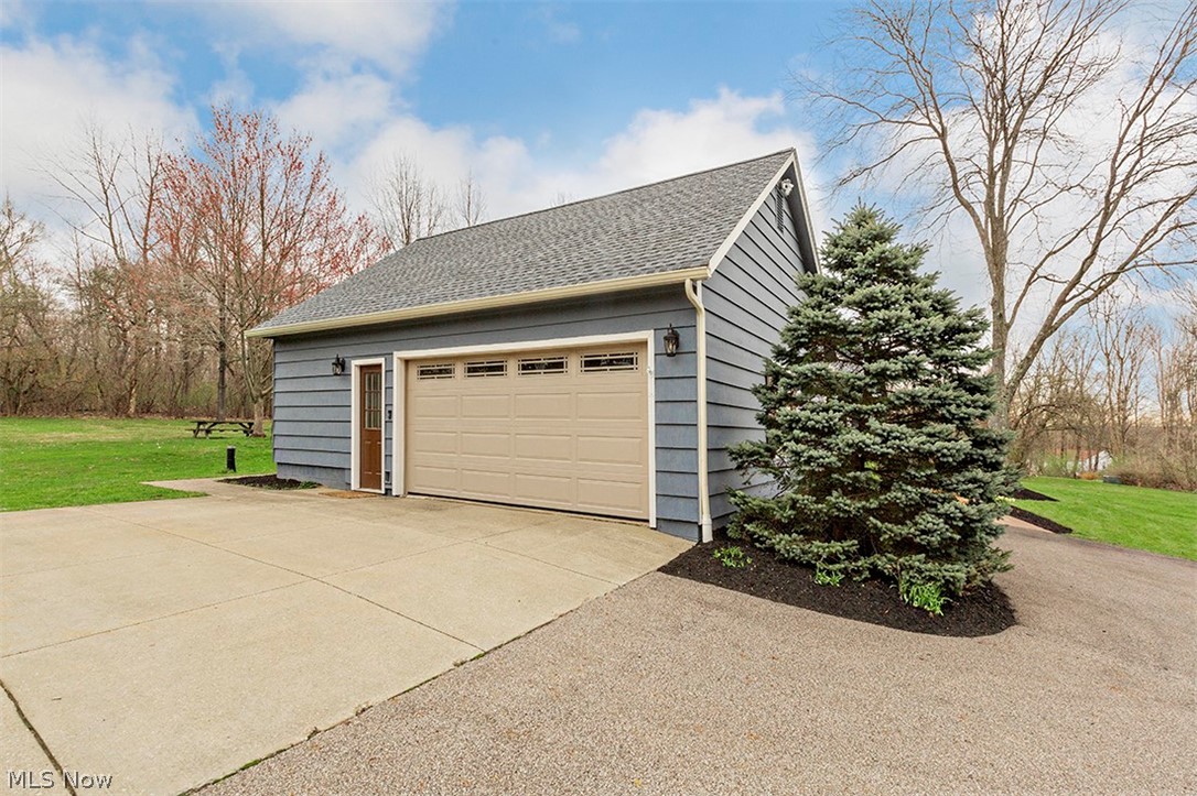 11390 Butternut Road Chardon, OH 44024 - Photo 17 of 21 Two-car garage with new door plus man door; driveway with loads of parking