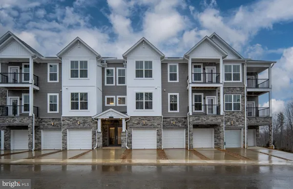a front view of a building with glass windows