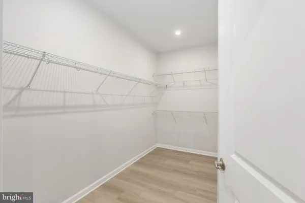 a bathroom with a double vanity sink mirror and shower