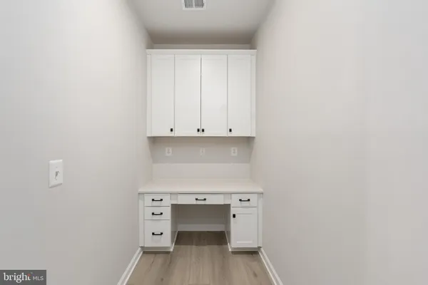 a bathroom with a double vanity sink toilet and shower