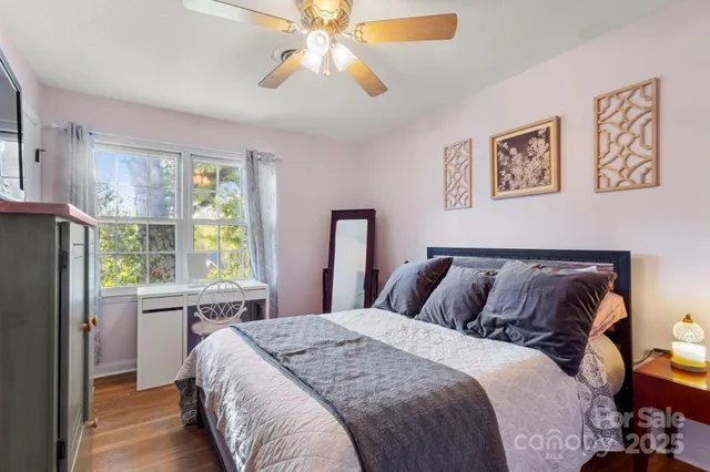 a bedroom with a large bed and a window