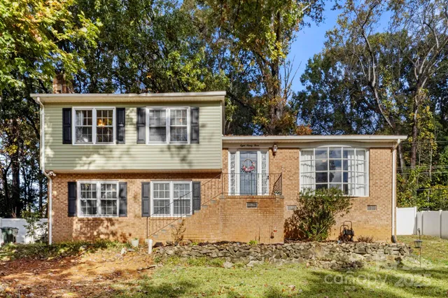 front view of a house that has a yard
