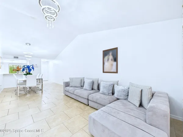 a living room with furniture and a table