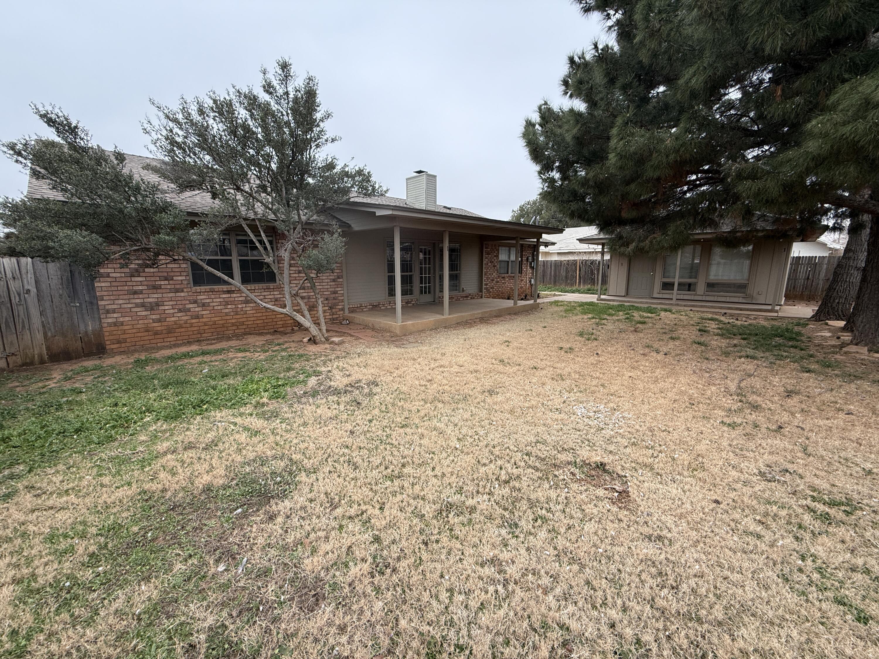 4828 11th Street Lubbock, TX 79416 - Photo 11 of 12 a view of a house with a yard