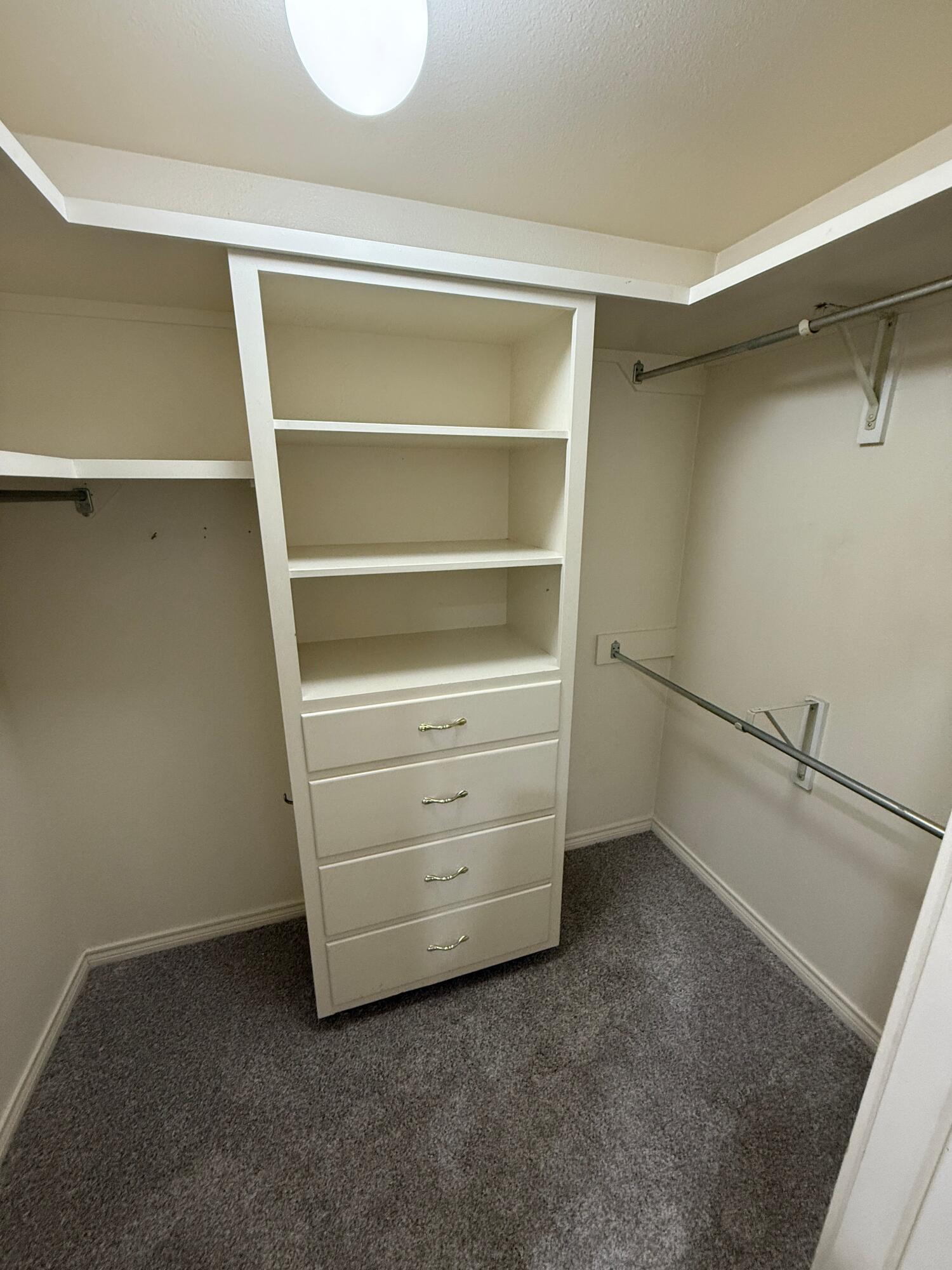 4828 11th Street Lubbock, TX 79416 - Photo 12 of 12 a view of an empty walk in closet