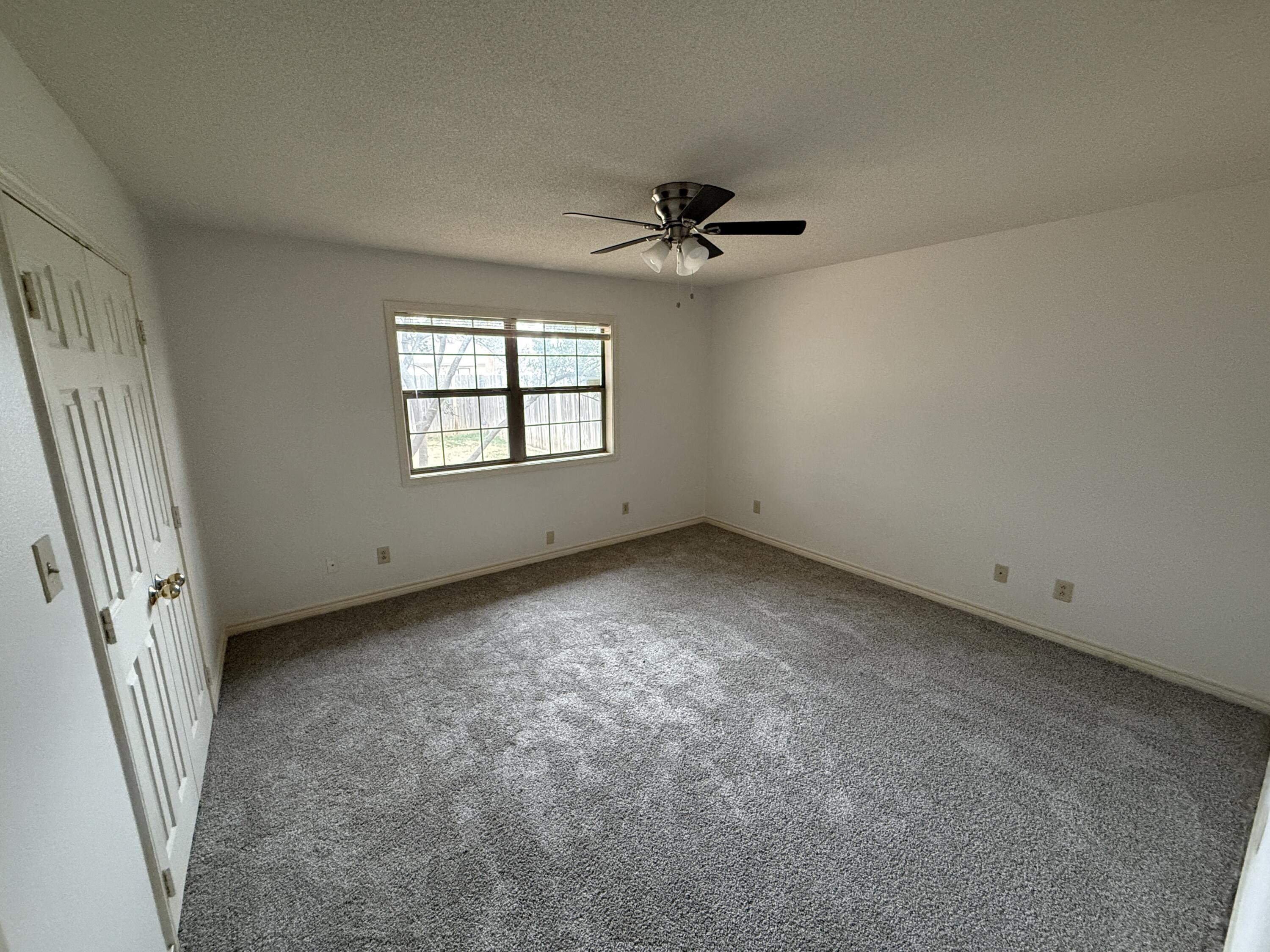 4828 11th Street Lubbock, TX 79416 - Photo 4 of 12 an empty room with a window