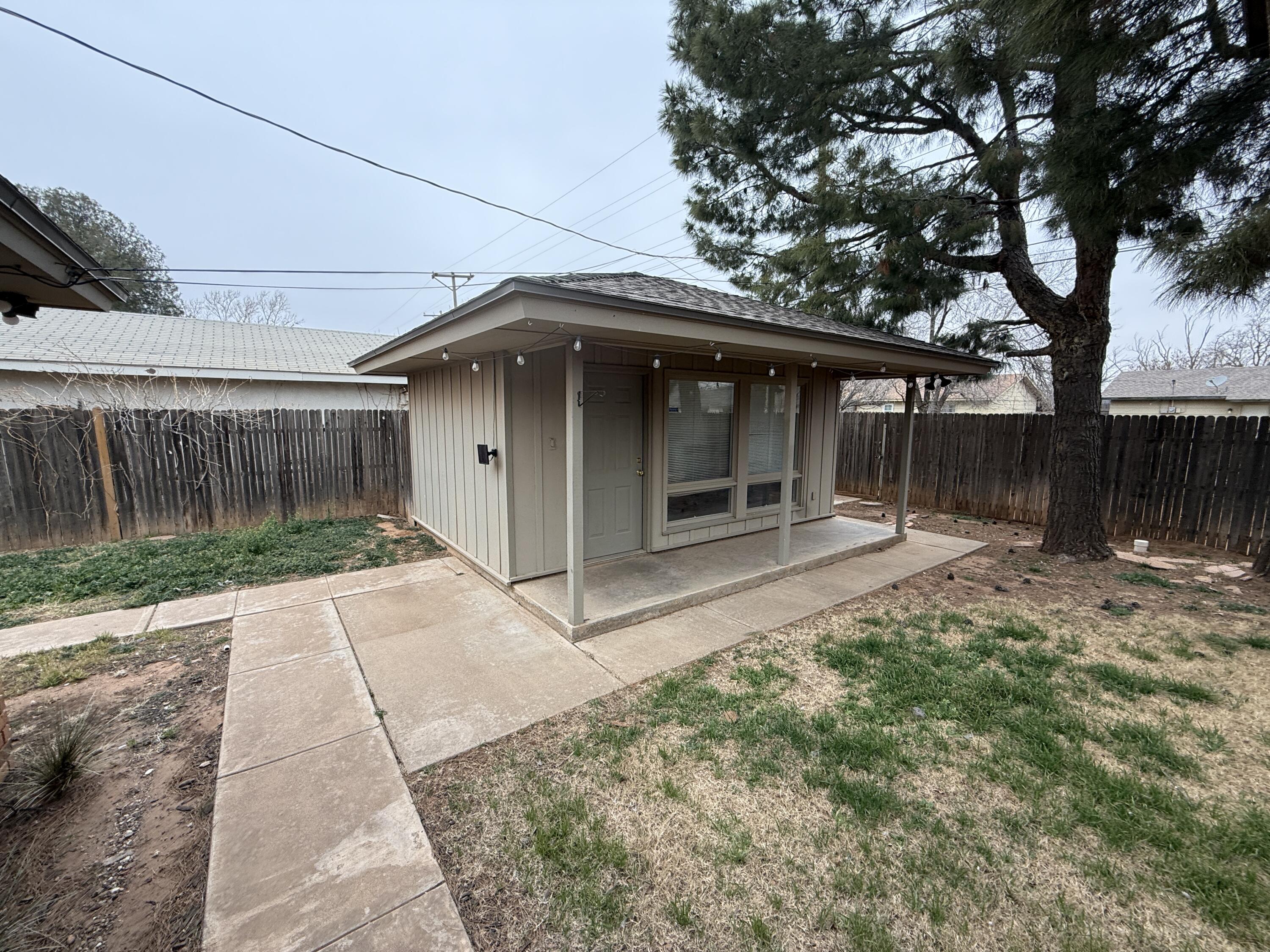 4828 11th Street Lubbock, TX 79416 - Photo 10 of 12 a view of a house with a yard
