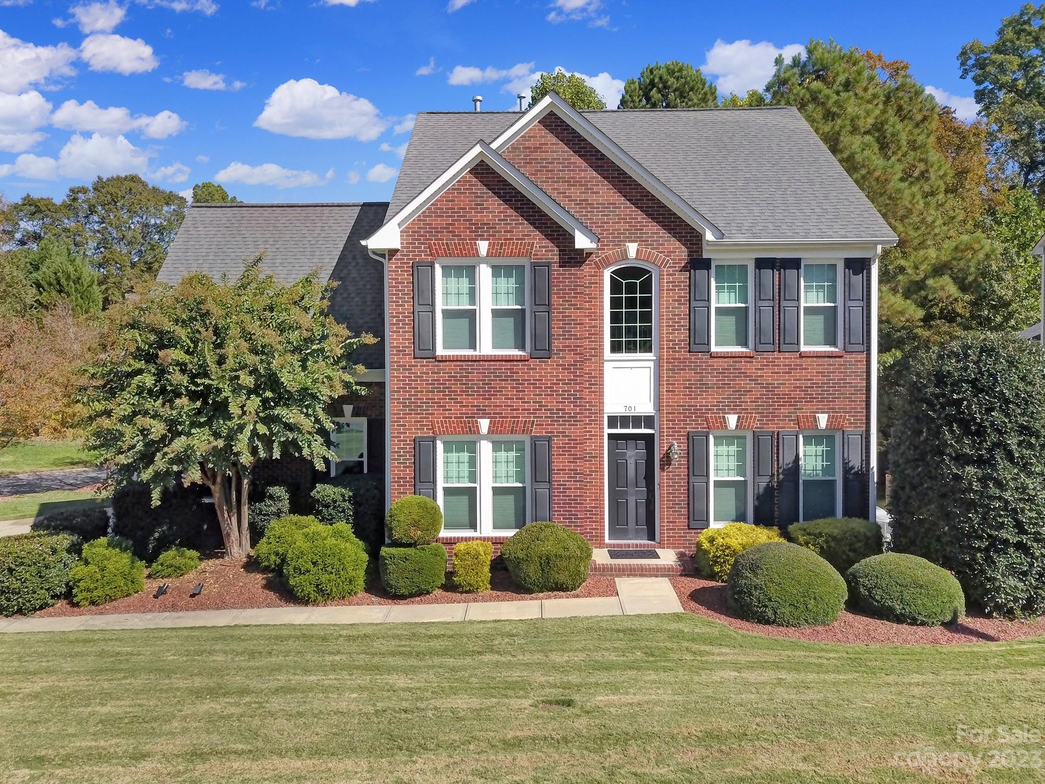 701 Drew Avenue Fort Mill, SC 29708 - Photo 1 of 37 a view of a brick house with a yard in front of it