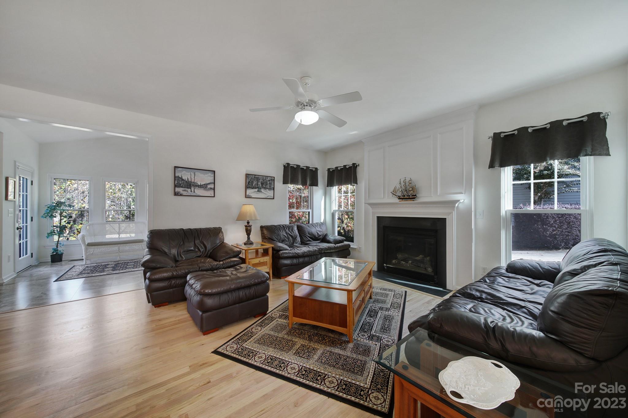 701 Drew Avenue Fort Mill, SC 29708 - Photo 8 of 37 a living room with furniture a window and a fireplace
