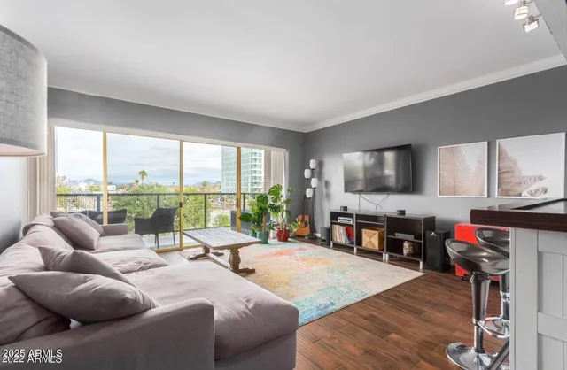 a living room with furniture and a flat screen tv