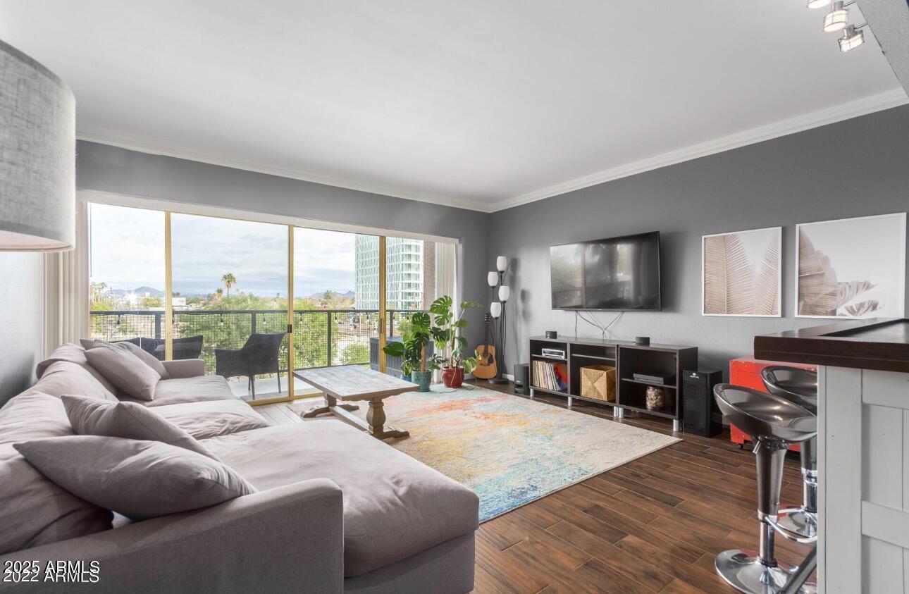 a living room with furniture and a flat screen tv