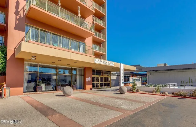 a swimming pool with outdoor seating and yard