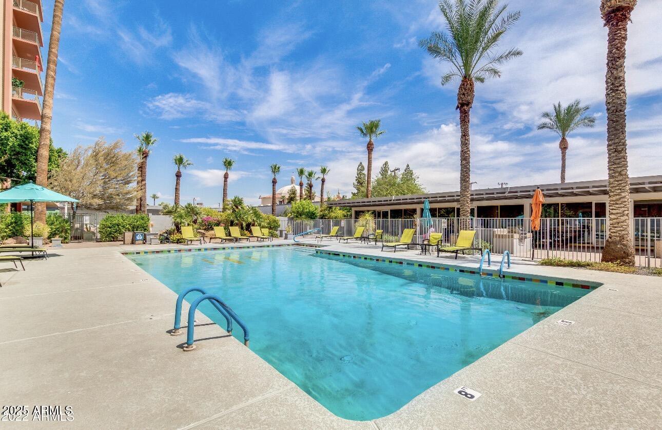 4750 North Central Avenue, Unit 3A Phoenix, AZ 85012 - Photo 15 of 24 a swimming pool with outdoor seating and yard