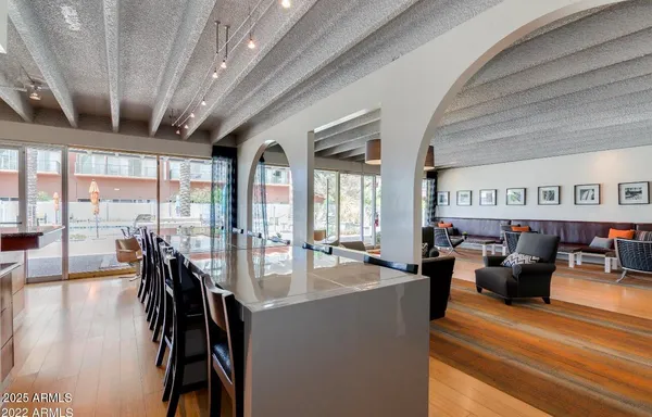 a lobby with furniture and a large window