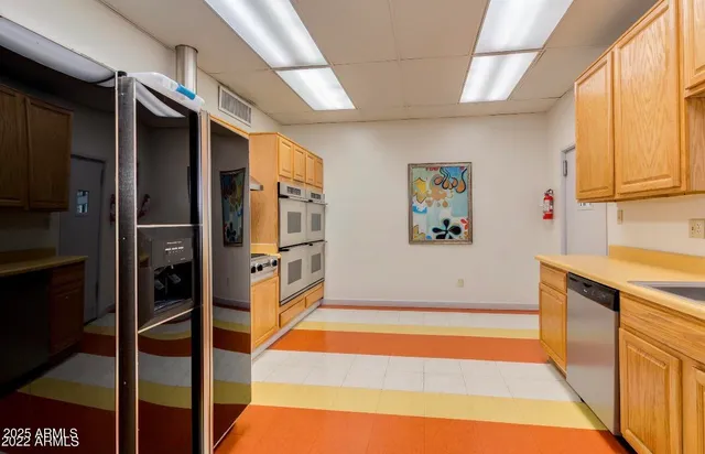 a living room with furniture a rug and a large window