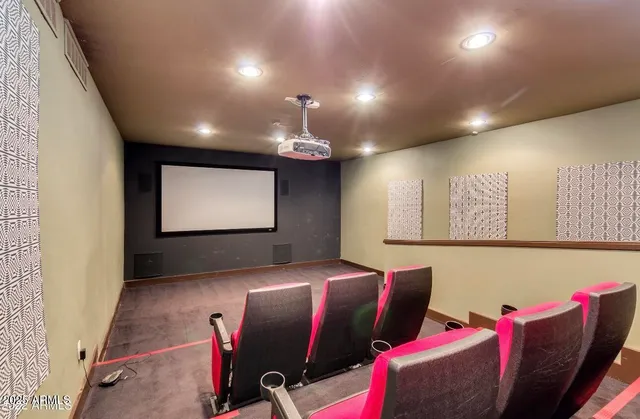 a living room with furniture potted plant and a large window