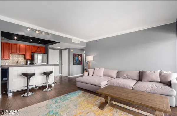 a living room with furniture and a table