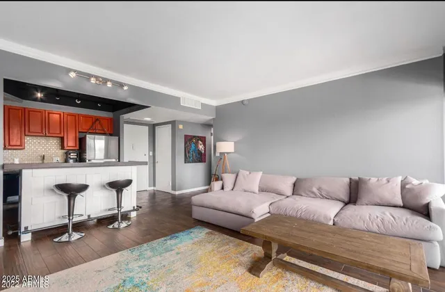 a living room with furniture and a table