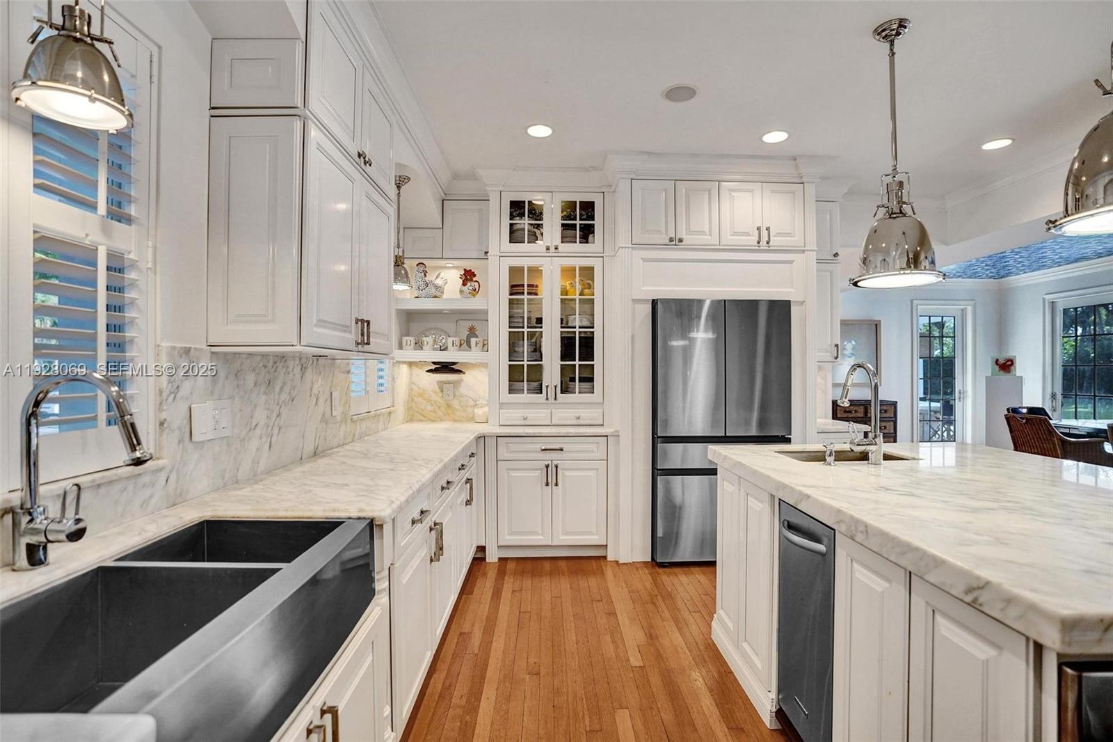 1281 Banyan Road Boca Raton, FL 33432 - Photo 34 of 69 a kitchen with stainless steel appliances granite countertop a sink stove and refrigerator