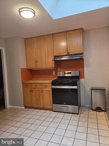 a kitchen with a stove and a microwave
