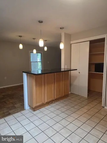 a view of a kitchen with wooden floor