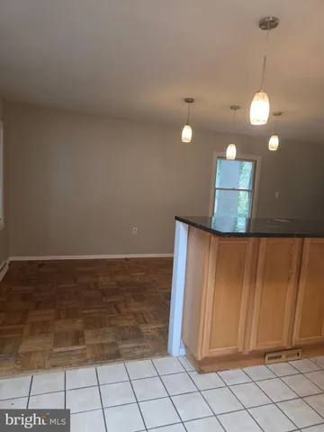 a view of a room with window and wooden floor