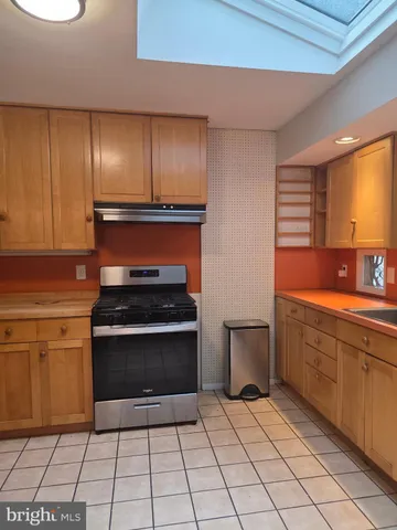a kitchen with a stove and a sink