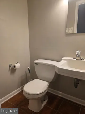 a bathroom with a toilet and a sink