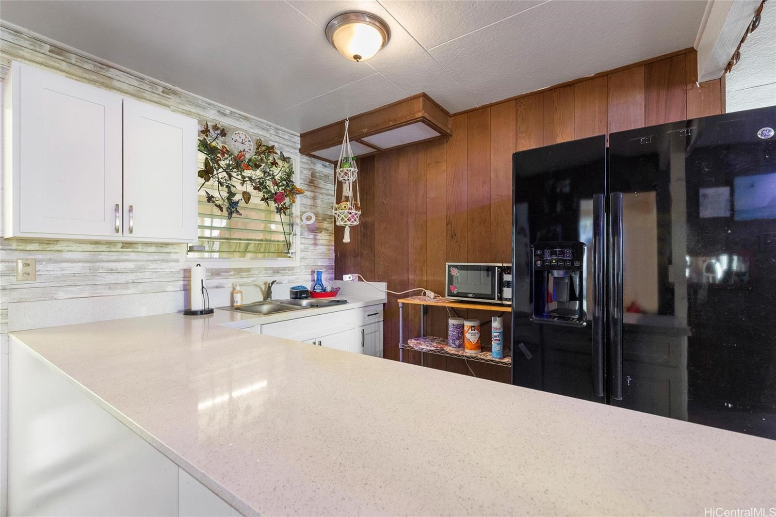 85-576 Waianae Valley Road, Unit A Waianae, HI 96792 - Photo 12 of 20 Downstairs wetbar w/refrigerator, and sink